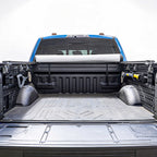 Open truck bed with a roll of JCWIN AUTO soft roll up cover on a white background