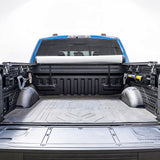 Open truck bed with a roll of JCWIN AUTO soft roll up cover on a white background