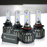 Four SYNETIC USA car LED headlights on a reflective surface with a dark background