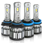 Set of four LED car light bulbs on a white background