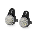 Two black circular LED light reflectors with silver trim and a textured clear lens, shown side by side on a white background.