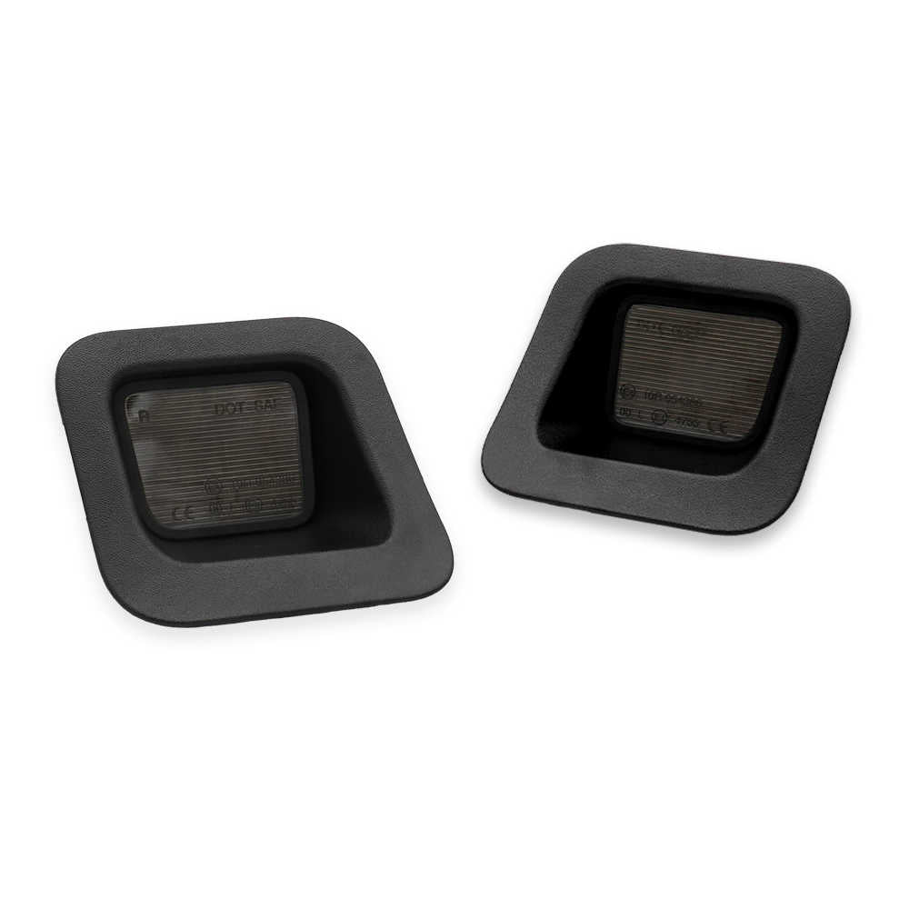 License plate lights with smoke lens for RAM. Two black square rubber grommets with square-shaped cutouts, displayed on a clean white background.