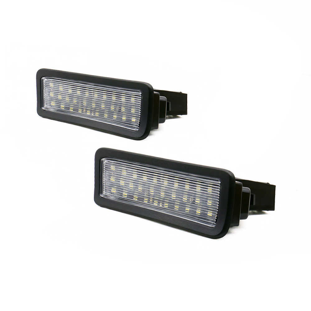 A pair of black rectangular LED license plate lights with clear ribbed lenses, shown on a plain white background.