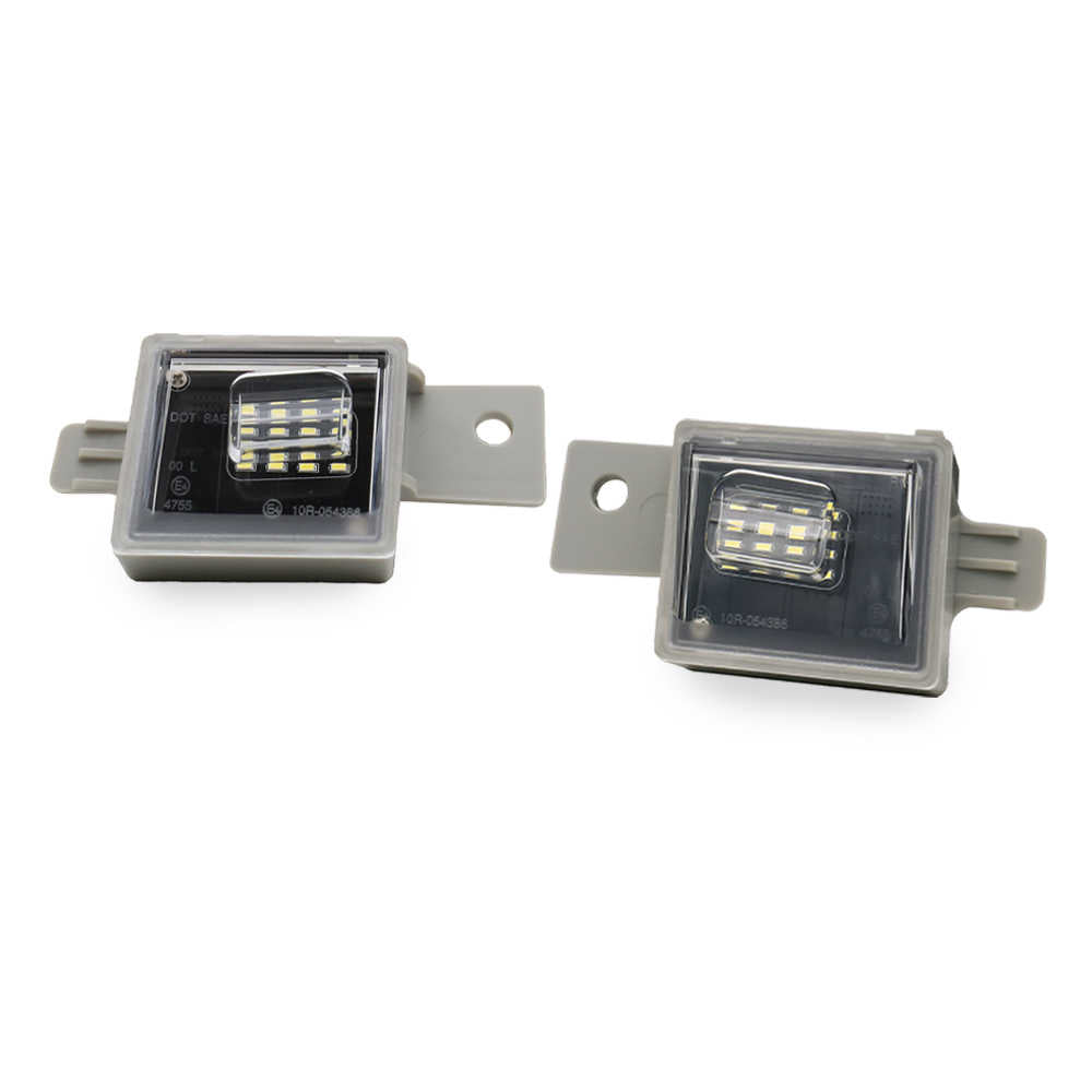 Two rectangular LED license plate lights with gray metal mounting brackets, shown on a plain white background.
