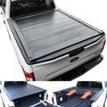 Truck bed with a tonneau cover and open storage compartment showing tools.