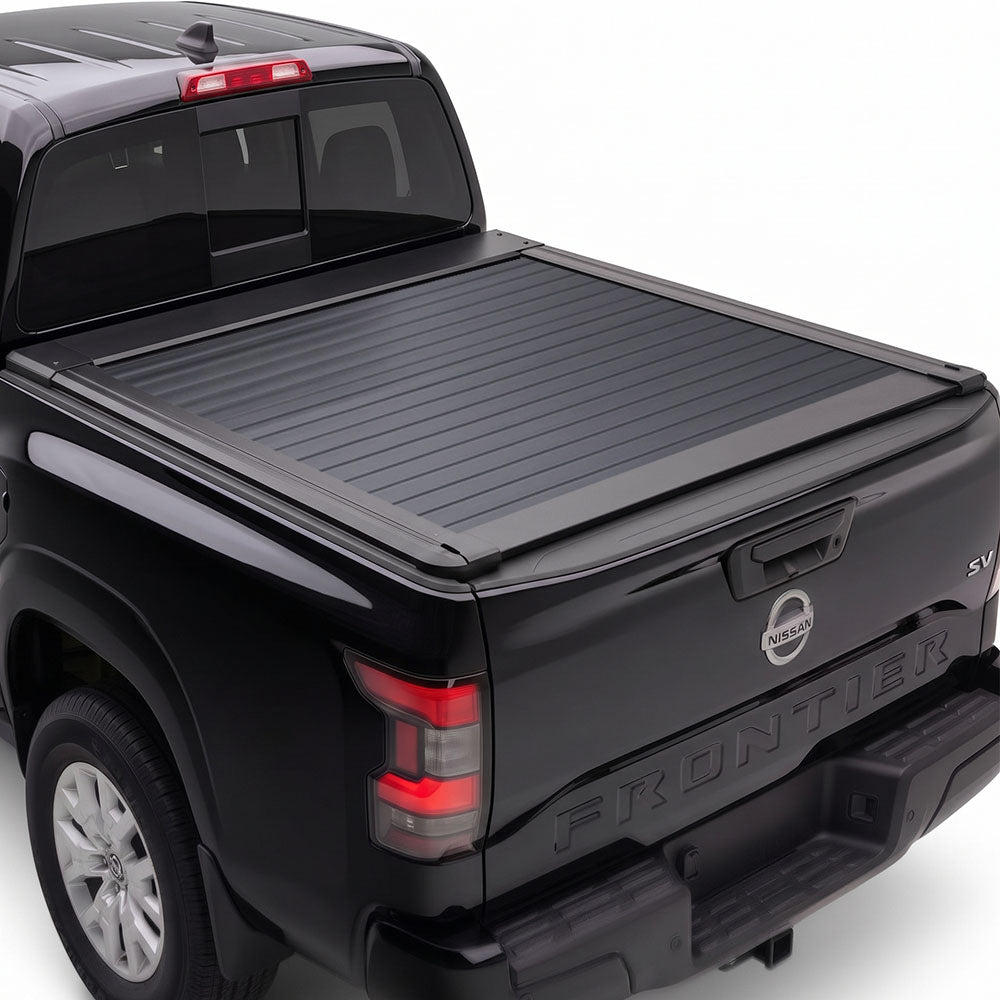 A black Nissan Frontier pickup truck with a black retractable tonneau cover