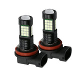 Two fog light bulbs with black and red housing on a white background