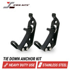 Two black stainless steel tie-down anchor brackets shown on a white background with the JCWIN AUTO logo at top left and text reading 'TIE DOWN ANCHOR KIT', 'HEAVY DUTY USE', and 'STAINLESS STEEL' at the bottom.