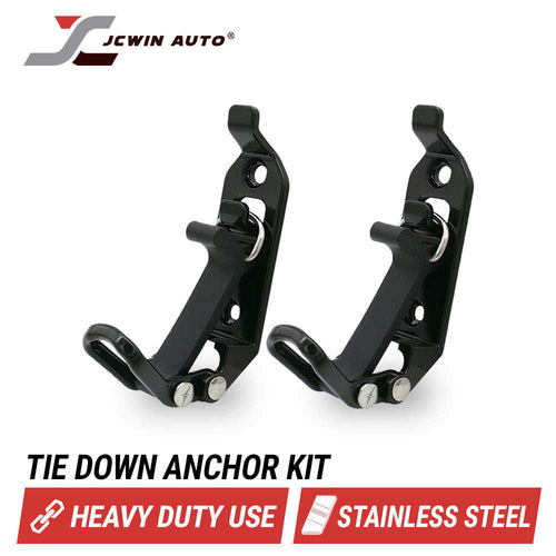 Two black stainless steel tie-down anchor brackets shown on a white background with the JCWIN AUTO logo at top left and text reading 'TIE DOWN ANCHOR KIT', 'HEAVY DUTY USE', and 'STAINLESS STEEL' at the bottom.
