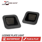 Two black square license plate light modules shown on a white background with the JCWIN AUTO logo at top left and text reading 'LICENSE PLATE LIGHT,' 'WATERPROOF,' and 'PLUG & PLAY' at the bottom.