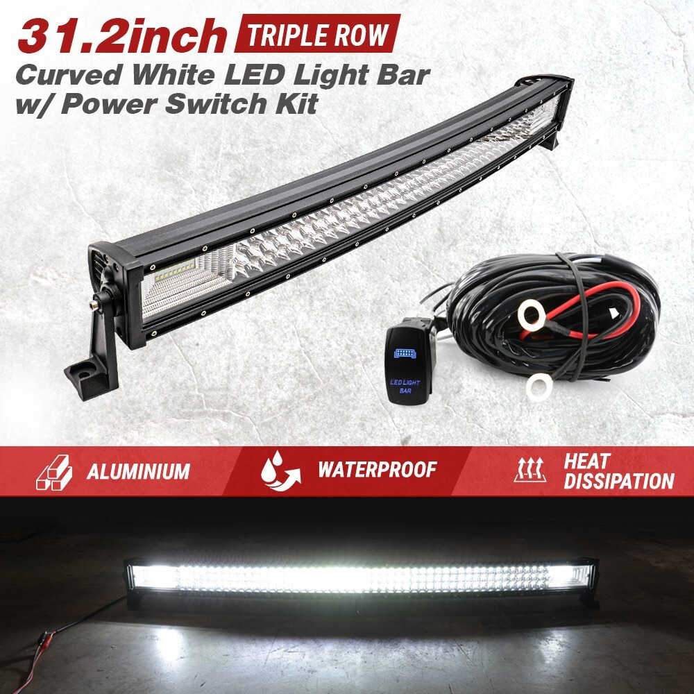 A 31.2-inch triple-row curved white LED light bar kit with a black housing, mounting bracket, wiring harness, and a small blue power switch module, shown on a light gray textured background with promotional text and feature icons.