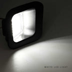 A square black LED light fixture casting a bright white light onto a plain surface, with the text 'WHITE LED LIGHT' in the bottom right corner.