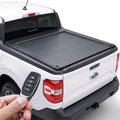 White Ford Maverick pickup truck with a retractable bed cover and remote key fob.