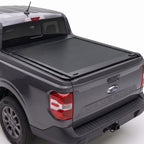 Manual retractable truck bed cover shown installed on a Gray Maverick pickup truck