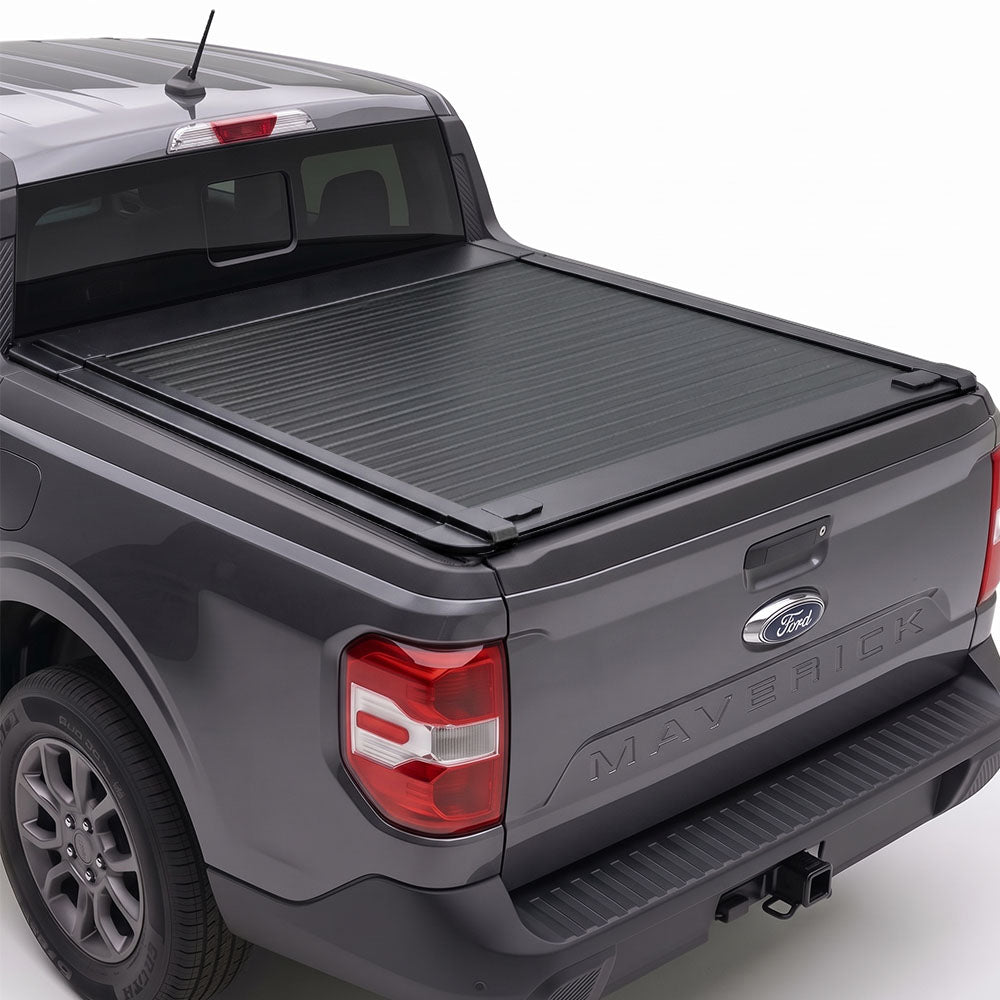 Manual retractable truck bed cover shown installed on a Gray Maverick pickup truck
