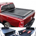 black RAMbox truck with a tonneau cover and an open storage compartment showing tools.