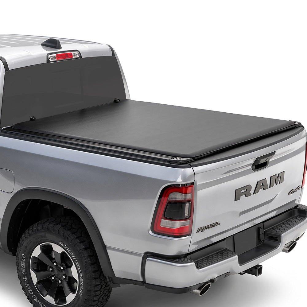 Silver Ram truck with a soft roll up tonneau cover