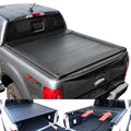 Black tonneau cover on a gray truck with open and closed views showing functionality.