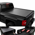 Black tonneau cover on a truck with open and closed views showing its functionality.