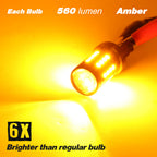 An amber LED light bulb shown glowing brightly on a yellow-orange background with text overlays reading 'Each Bulb 560 lumen Amber' and '6X Brighter than regular bulb'.