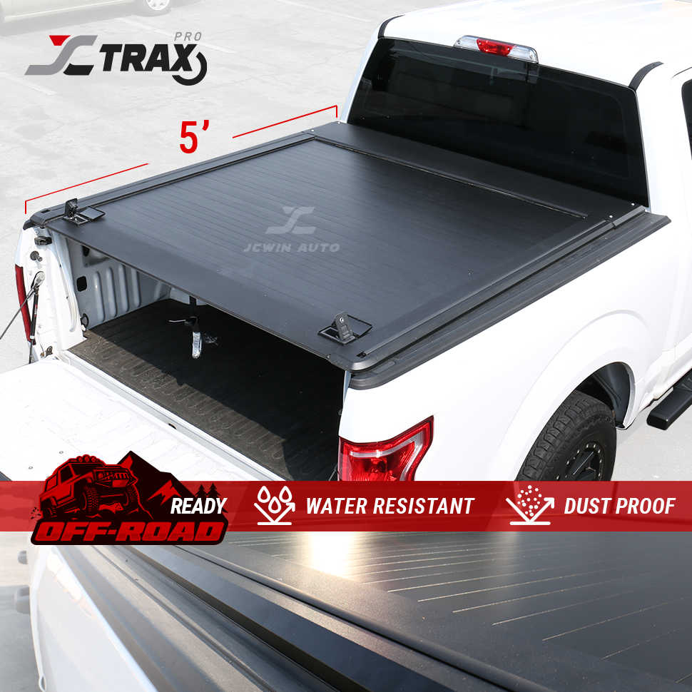 5ft Truck bed cover with JC Trax branding on a white truck