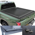 Green Toyota Tundra truck with a tonneau cover, key fob, and additional cover on a white background.