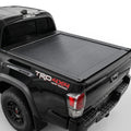 The truck features a matte black retractable bed cover