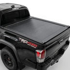The truck features a matte black retractable bed cover