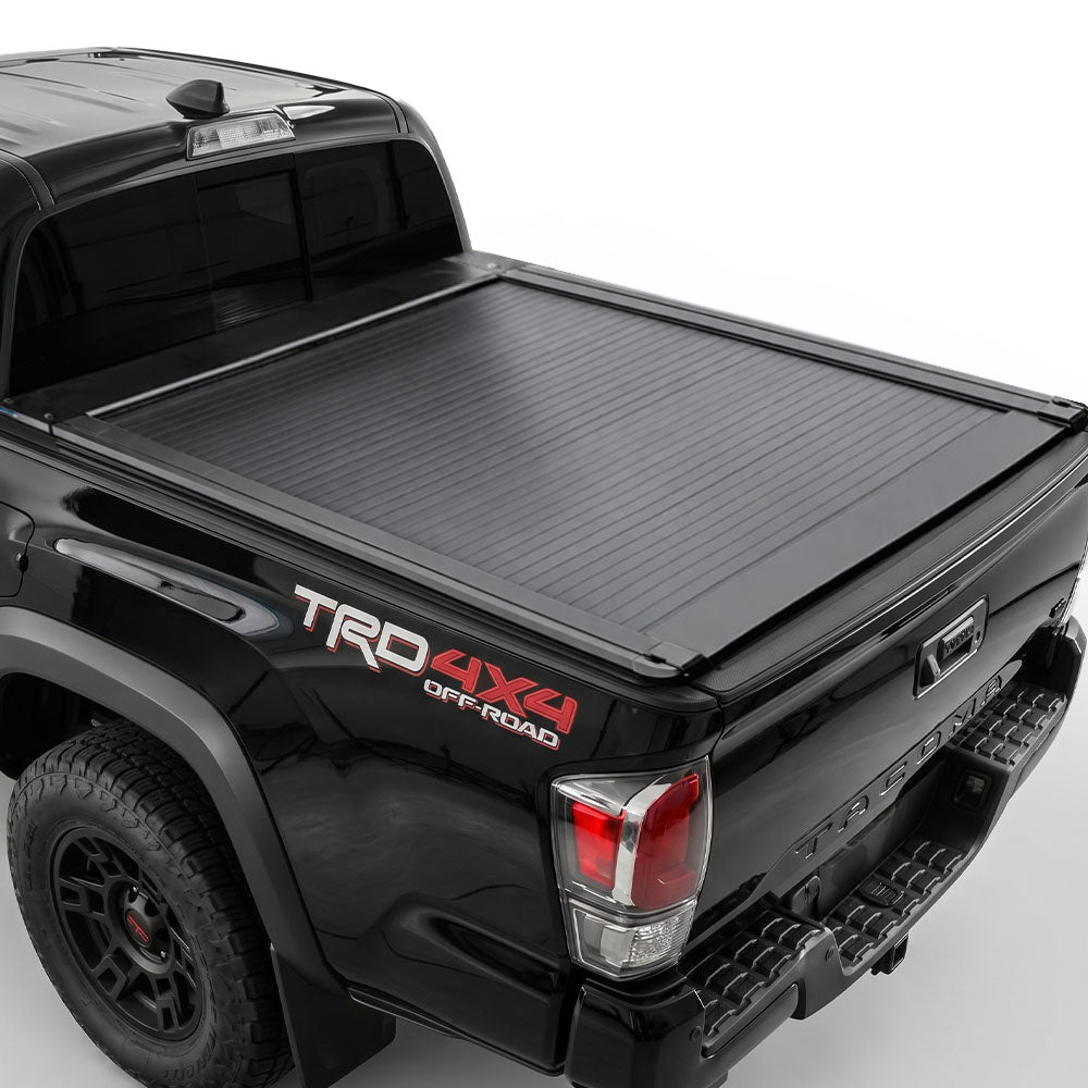 The truck features a matte black retractable bed cover