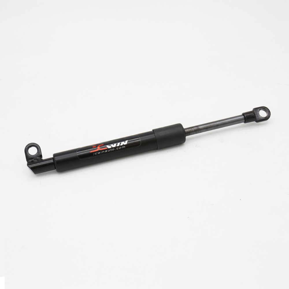 A black hydraulic power steering assist cylinder with a silver metal rod and end fittings, featuring the 'JCWIN' brand logo printed on the side, set against a plain white background.