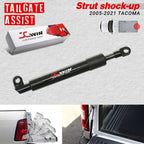 Black Jcwin tailgate assist strut shock absorber for 2005-2020 Tacoma, shown with its retail box, a small vehicle diagram, and inset photos of the product installed on a truck tailgate.