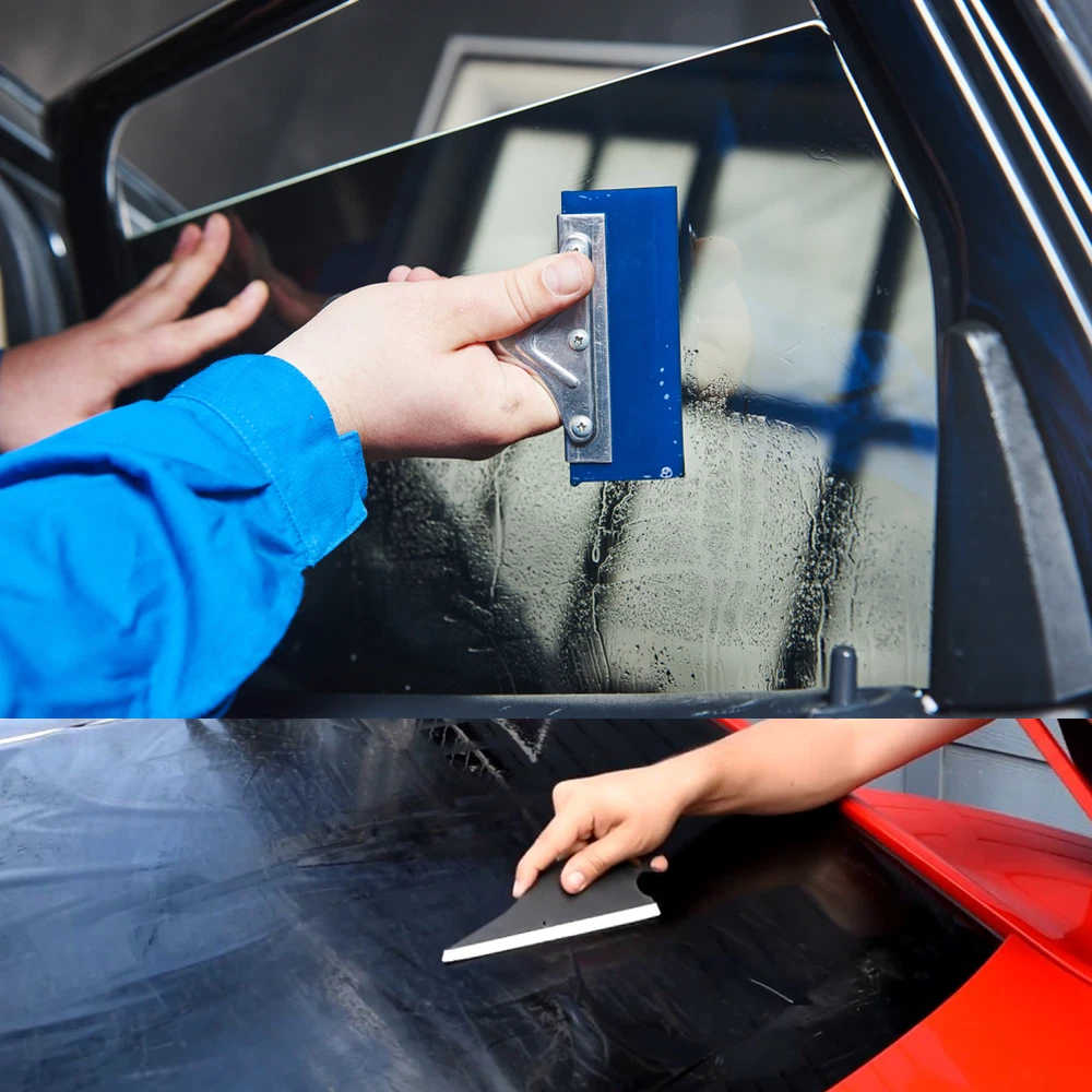 Installing car window tint with squeegee tools for smooth finish