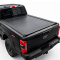 A truck bed cover installed on the bed of a black Ford F-250 Super Duty pickup truck.
