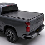 Gray Silverado truck with a tonneau cover on a white background