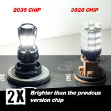 Two LED light bulbs with '2835 CHIP' and '3528 CHIP' labels on a dark surface.