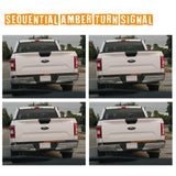 White truck showing sequential amber turn signal lights in four different stages.