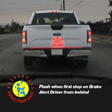 Back of a white truck with a red 'Flash' logo and safety feature description.