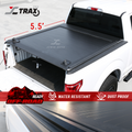 A black retractable tonneau cover on a white truck, highlighting its water resistant and dust proof features.